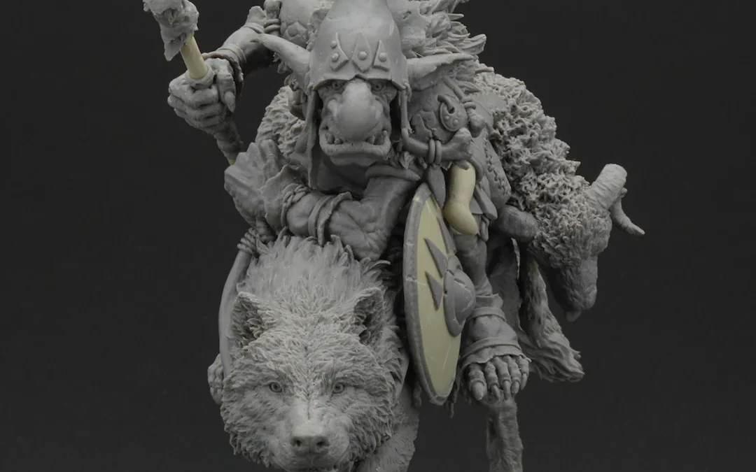 Sculpture of a man in armor riding a standing wolf, helmet raised