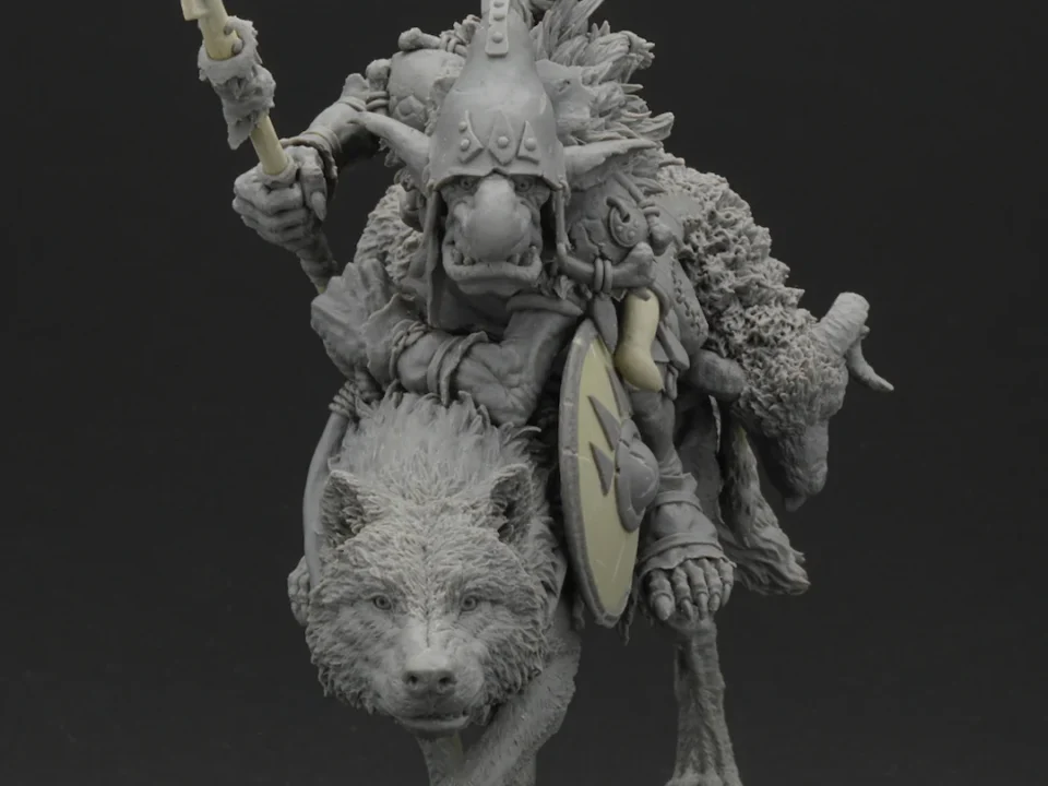 Sculpture of a man in armor riding a standing wolf, helmet raised