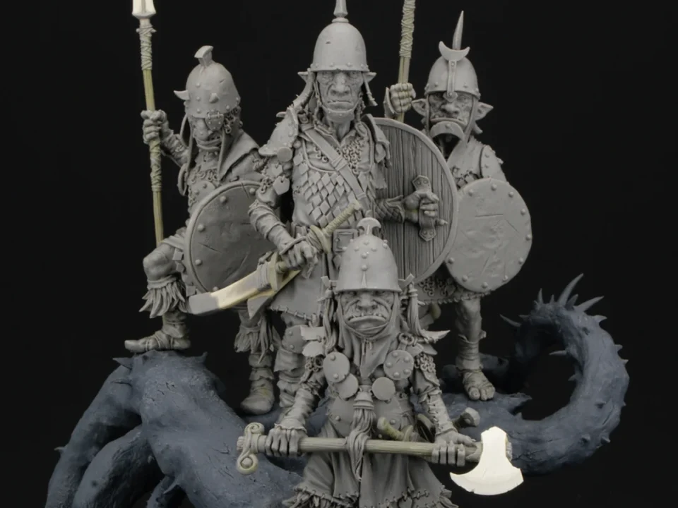 Miniature black soldiers holding weapons on a rock, crafted for Black Sun Miniatures