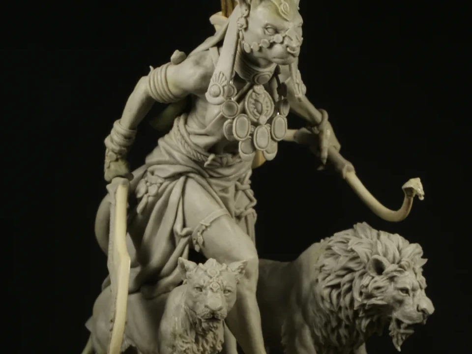 Handcrafted warrior statue with a fierce expression, holding a sword