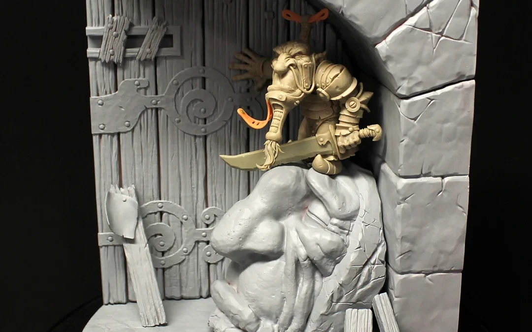 Miniature figurine of a man holding a sword, part of ‘Journeyman Miniatures’ by Paul Bonner, set against a gated wall