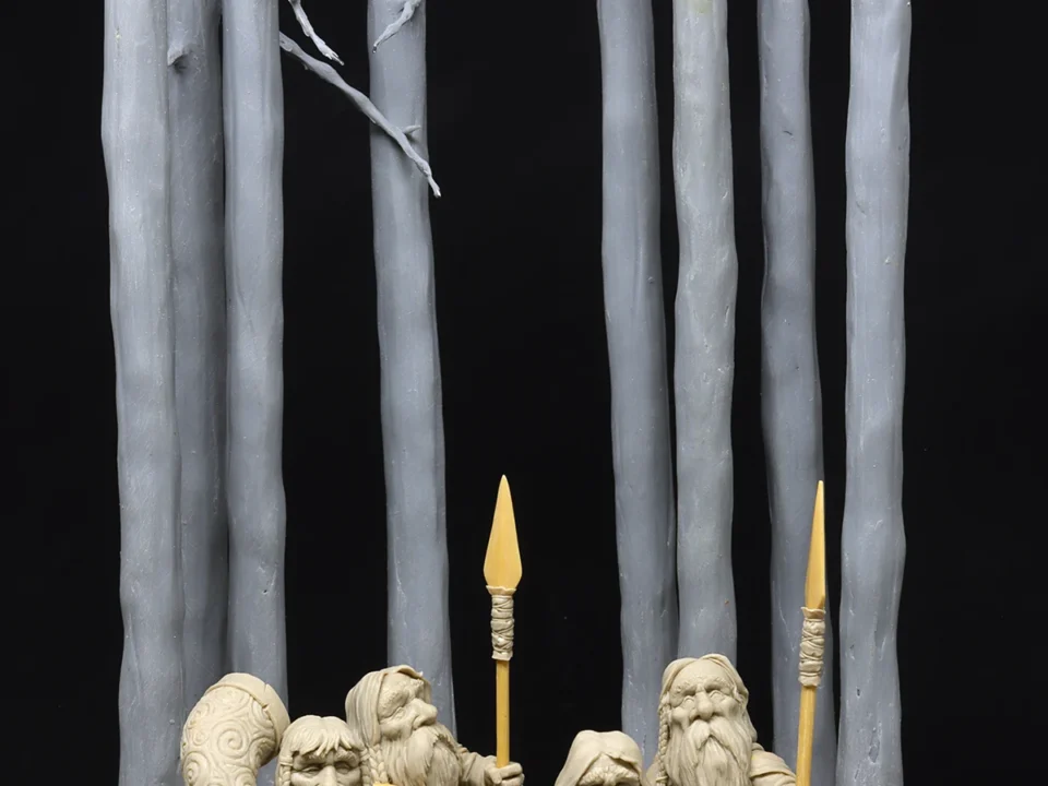 Group of sculpted dwarves holding weapons, standing in front of a tall tree, dark background with text