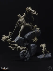 Statue of a man holding a sword atop a rock, surrounded by smaller sculptures in a dark, artistic composition