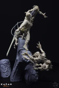 Hand-carved Kazam warrior figure with a sword on a rock in close-up