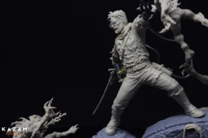 3D printed man holding a sword standing on a rock, with the word 'KAZAM' visible in the background